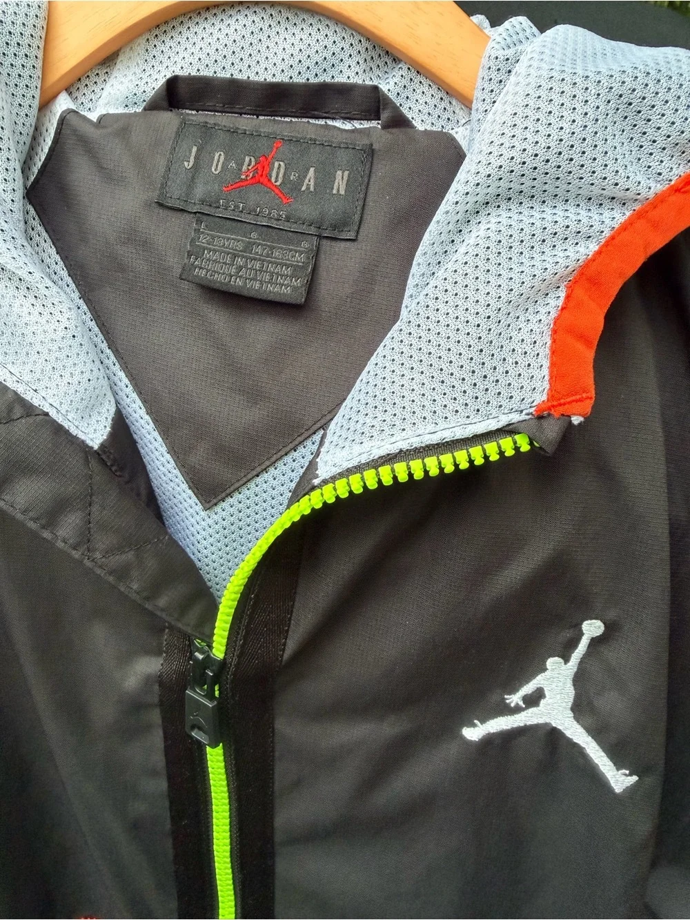 Jordan Youth Black Jacket with Neon Yellow-Green Zipper and Red Accents